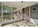 View of the screened-in porch that features views of the beautiful surrounding greenery at 1725 Feature Rd, Lancaster, SC 29720