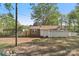 Back of single-story home with carport, deck, and large storage shed on a large lot at 1725 Feature Rd, Lancaster, SC 29720
