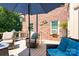Backyard deck featuring outdoor furniture, a grill and a shade umbrella at 5300 Green Rea Rd, Charlotte, NC 28226