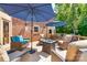 Backyard deck featuring outdoor furniture, an umbrella and fire pit at 5300 Green Rea Rd, Charlotte, NC 28226