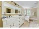 Elegant bathroom with a clawfoot tub, double sinks, and modern fixtures at 5300 Green Rea Rd, Charlotte, NC 28226