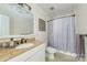 Bathroom featuring a granite vanity, toilet and shower with patterned curtain at 5300 Green Rea Rd, Charlotte, NC 28226
