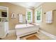 Bathroom featuring a classic clawfoot bathtub, with natural light from two large windows at 5300 Green Rea Rd, Charlotte, NC 28226