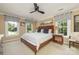 Cozy bedroom with a large bed, side tables, and multiple windows for plenty of natural light at 5300 Green Rea Rd, Charlotte, NC 28226