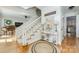 Bright foyer with a staircase, hardwood floors, decorative accents, and a neutral color scheme, creating a welcoming atmosphere at 5300 Green Rea Rd, Charlotte, NC 28226