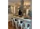 Kitchen with a breakfast bar featuring seating, stainless steel appliances, and white cabinetry for a clean, modern look at 5300 Green Rea Rd, Charlotte, NC 28226