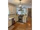 Kitchen featuring stainless steel appliances, white cabinetry, and hardwood floors, blending functionality with style at 5300 Green Rea Rd, Charlotte, NC 28226