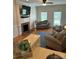 A comfortable living room features a fireplace, hardwood floors, and natural light at 5300 Green Rea Rd, Charlotte, NC 28226