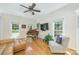 A bright living room features a piano, hardwood floors, and large windows at 5300 Green Rea Rd, Charlotte, NC 28226
