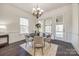 Dining nook with round table, chandelier, and access to outdoor porch at 625 Highland Ridge Pt, Clover, SC 29710