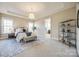 Bright, spacious main bedroom with a tray ceiling, carpet floors, and large windows at 625 Highland Ridge Pt, Clover, SC 29710