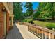 Spacious deck with railing and wooded views at 118 Cramer Mountain Woods Rd, Cramerton, NC 28032