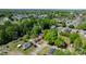 An aerial view of a neighborhood featuring mature trees and single-Gathering homes with well-kept lawns at 112 S 2Nd Ave, Maiden, NC 28650