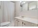 Bright bathroom with a classic vanity, tub/shower combo, and tiled walls at 112 S 2Nd Ave, Maiden, NC 28650