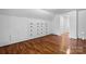 Bedroom featuring hardwood floors and built-in storage at 112 S 2Nd Ave, Maiden, NC 28650