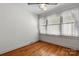 Bright bedroom with hardwood floors, large windows, and a ceiling fan at 112 S 2Nd Ave, Maiden, NC 28650