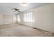 Bedroom featuring carpeted floor and a ceiling fan at 112 S 2Nd Ave, Maiden, NC 28650