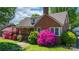 Quaint brick home with beautiful landscaping and a cozy covered porch at 112 S 2Nd Ave, Maiden, NC 28650