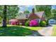 Charming brick home featuring a manicured lawn and vibrant azalea bushes at 112 S 2Nd Ave, Maiden, NC 28650