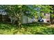 View of detached garage with tree shading it in backyard at 112 S 2Nd Ave, Maiden, NC 28650