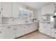 Bright, all white kitchen with updated appliances and ample cabinet space at 112 S 2Nd Ave, Maiden, NC 28650