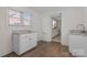 Pantry with wood look floors, granite countertops and access to kitchen at 112 S 2Nd Ave, Maiden, NC 28650