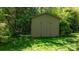 Storage shed with wood siding and a double door at 112 S 2Nd Ave, Maiden, NC 28650