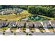 Aerial view of homes in a beautiful community that features a pond with water feature near a wooded area at 8121 Festival Way, Charlotte, NC 28215
