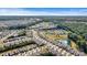 Panoramic aerial view showcasing a well-planned community nestled in lush greenery and a pond with a fountain at 8121 Festival Way, Charlotte, NC 28215