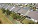 A high aerial view showing homes with fenced backyards adjacent to a well-landscaped community in a suburban neighborhood at 8121 Festival Way, Charlotte, NC 28215