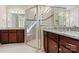 Main bathroom with dual sink vanity, walk-in shower and tiled floors at 8121 Festival Way, Charlotte, NC 28215