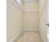 A carpeted walk-in closet features white walls and metal shelving at 8121 Festival Way, Charlotte, NC 28215