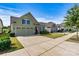 Home exterior showcasing a 2-car garage, well-maintained lawn and landscape at 8121 Festival Way, Charlotte, NC 28215