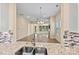 Open-concept living area with stainless steel sink, modern finishes and a fireplace at 8121 Festival Way, Charlotte, NC 28215