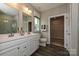 Double vanity bathroom with large shower and walk-in closet at 144 Hudson Point Dr, Troutman, NC 28166