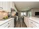 Modern kitchen with white cabinets, quartz countertops and stainless steel appliances at 144 Hudson Point Dr, Troutman, NC 28166