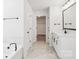 Bathroom featuring double doors, soaking tub, walk-in closet, and vanity at 5108 Silver Creek Ln, Denver, NC 28037