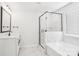 Bathroom featuring black trim shower, soaking tub, vanity, and modern fixtures at 5108 Silver Creek Ln, Denver, NC 28037