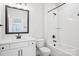 Bright bathroom with a vanity, toilet, and a shower and bathtub combo with white subway tile surround at 5108 Silver Creek Ln, Denver, NC 28037