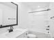 A clean bathroom features modern fixtures, a large mirror, and a shower and tub combination at 5108 Silver Creek Ln, Denver, NC 28037