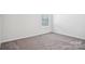 Bedroom with neutral carpet and window at 5108 Silver Creek Ln, Denver, NC 28037