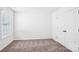 Bedroom with neutral carpet, window, and white doors at 5108 Silver Creek Ln, Denver, NC 28037