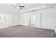 Bright bedroom with neutral carpet, access to walk-in closet, and ensuite bathroom at 5108 Silver Creek Ln, Denver, NC 28037