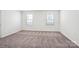 Spacious bedroom with neutral carpet, recessed lighting and two windows at 5108 Silver Creek Ln, Denver, NC 28037