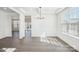 Bright dining room with hardwood floors, detailed trim, and modern lighting at 5108 Silver Creek Ln, Denver, NC 28037