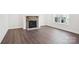 Cozy fireplace featuring stone accents and natural light from the window at 5108 Silver Creek Ln, Denver, NC 28037