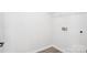 Bright laundry room with modern tile floor, hookups for washer and dryer at 5108 Silver Creek Ln, Denver, NC 28037