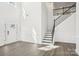 Bright living room featuring hardwood floors, high ceilings, and a staircase at 5108 Silver Creek Ln, Denver, NC 28037