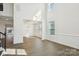 Bright living room featuring hardwood floors, high ceilings, and large windows at 5108 Silver Creek Ln, Denver, NC 28037