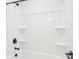 A sleek shower is equipped with recessed shelving and modern fixtures for a luxurious experience at 5108 Silver Creek Ln, Denver, NC 28037